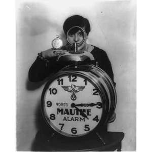  Miss Ella Nachman,normal sized alarm clock in her hand 
