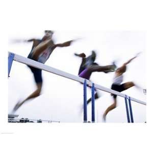   three men jumping over a hurdle Poster (24.00 x 18.00)