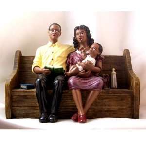  African American Church Couple with Baby in Pew 