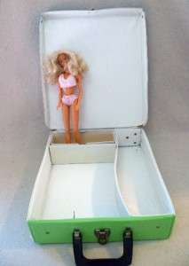 am selling 1962 Barbie & Midge, a metal stand, a 1963 case & a large 
