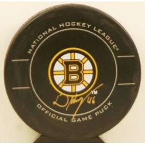David Krejci Autographed Official Bruins Game Puck   Autographed NHL 