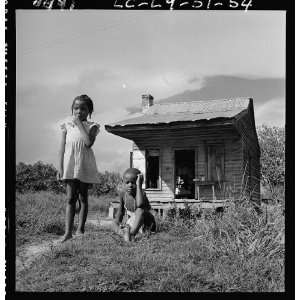  American girl,boy,dilapidated cabin,poverty,living conditions,South 