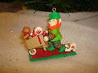Rennoc Elf Pushing Wheel Barrel Of Toys Christmas Ornament 1991