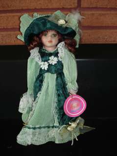 Menie Porcelain Doll with Pretty Green Dress and Pearls  