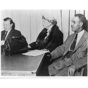 Eleanor Roosevelt and Roy Wilkins seated at table